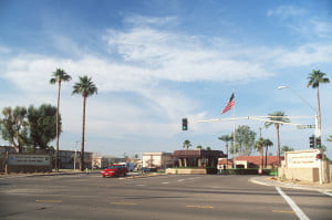 A long-range view of the main gate with the base signs in the foreground.